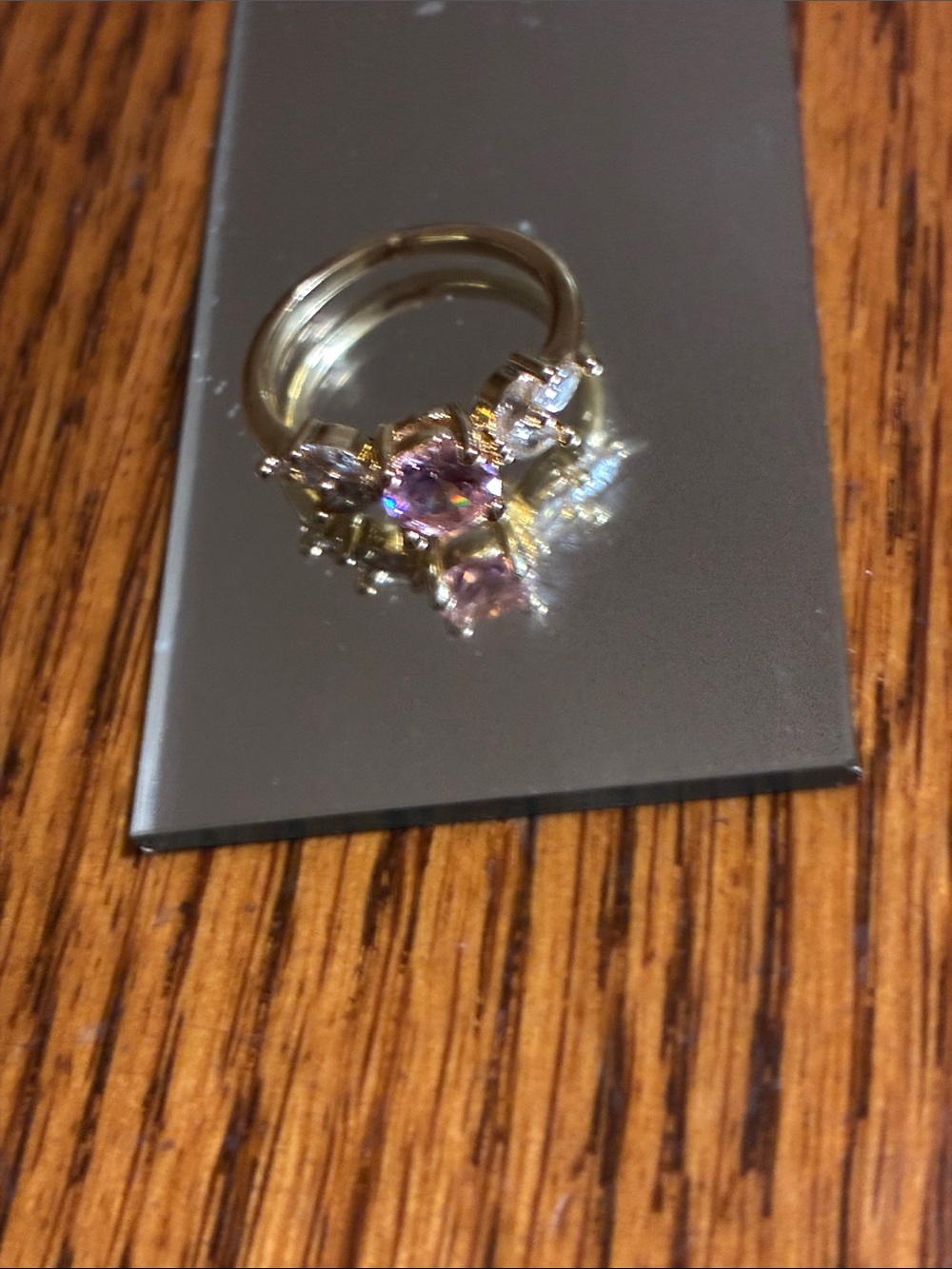 Gold Ring with Pink Center Gem and Clear Side Stones